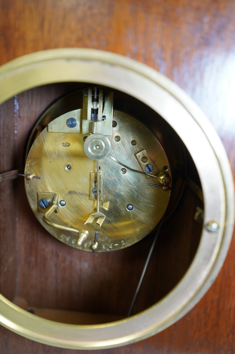 A George V mahogany and ebonised eight day movement mantel clock, 27cm high. Condition - good - No bell.